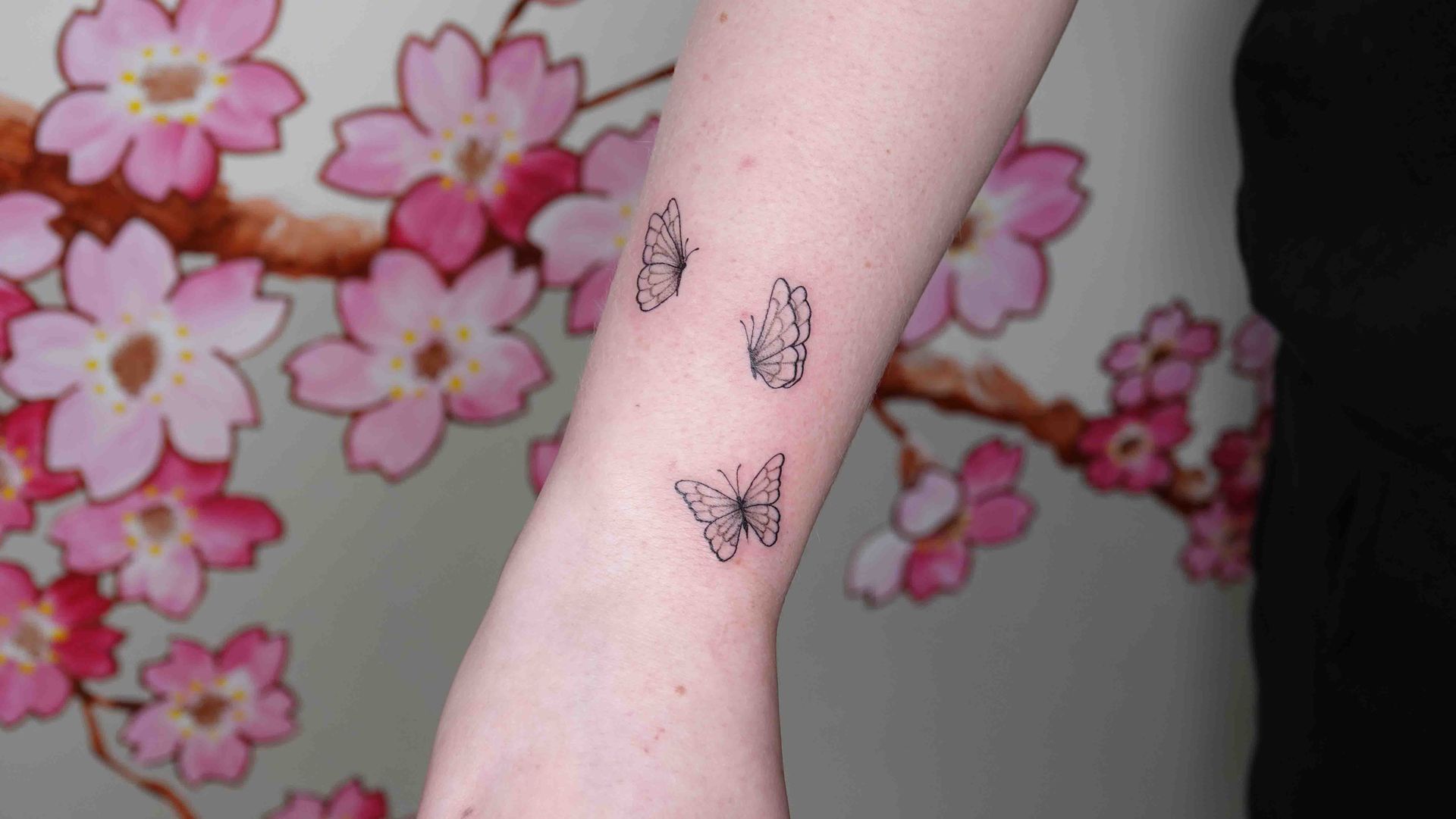 Kleine vlinders op een onderarm